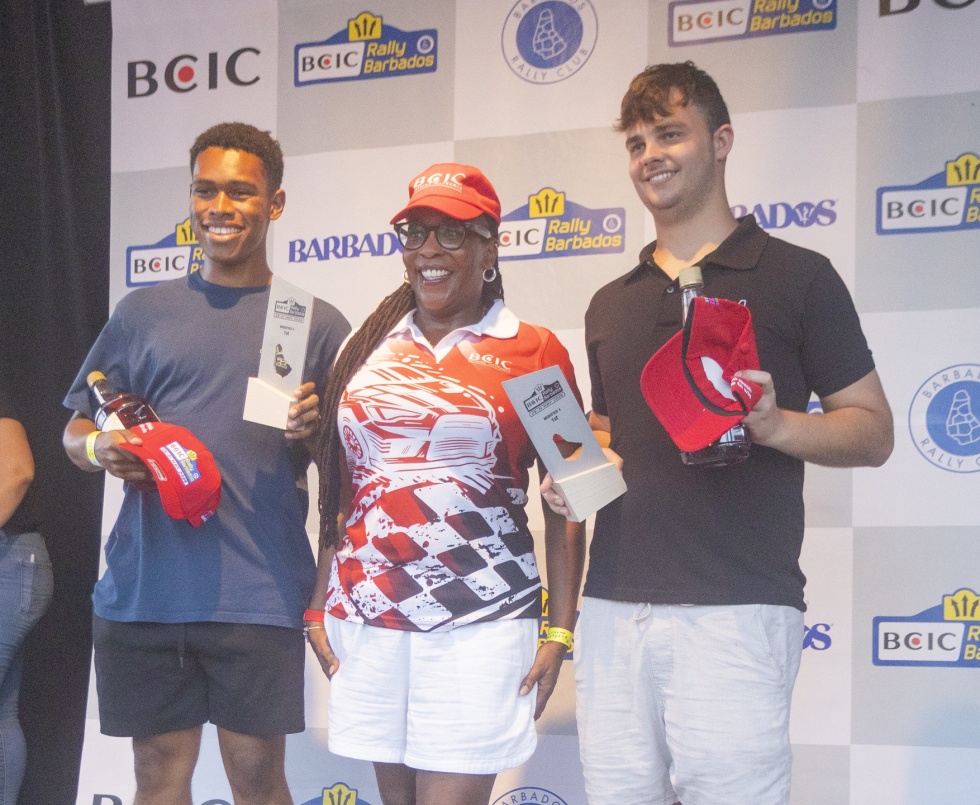 In his first year in four-wheel-drive David-Anthony Balgobin (left) and co-driver Elijah Marshall won M4; pictured with presenter Amanda Nurse, Product Manager, BCIC Barbados