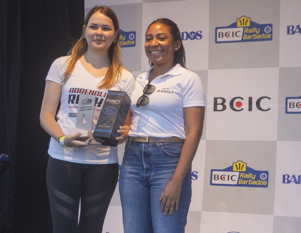 Highest-placed Female Co-driver, 19-year-old Chloe Mustor (left) receives her awards from Alexandra Leacock, Branch Manager, BCIC Barbados